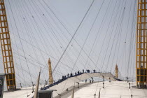 England, London, Greenwich, people on the 02 Arena rooftop walkway.