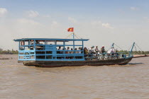 Vietnam, Mekong Delta, Cai Be, Passengers commuting on a small ferry boat.