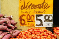 Mexico, Bajio, Guanajuato, Street stall selling tomatoes and sweet potatoes.