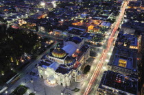 Mexico, Federal District, Mexico City, View across the city from Torre Latinoamericana at night with Palacio Bellas Artes in the foreground.