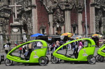 Mexico, Federal District, Mexico City, Pedi taxis outside the Cathedral in the Zocalo.