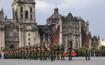 Mexico, Federal District, Mexico City, Soldiers and military police performing the daily Flag Lowering Ceremony in the Zocalo.