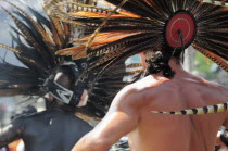 Mexico, Federal District, Mexico City, Michicoa Aztec dancers performing in the Zocalo.