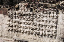 Mexico, Federal District, Mexico City, Replica tzompantli or wall of skulls in Templo Mayor Aztec temple ruins.