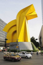 Mexico, Federal District, Mexico City, Traffic passing Little Horse sculpture of Torre Caballito on Reforma.