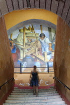 Mexico, Bajio, San Miguel de Allende, Bellas Artes, Mural by Pedro Martinez dated 1940 with woman descending flight of stairs in foreground.