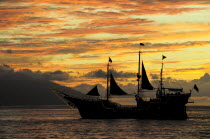 Mexico, Jalisco, Puerto Vallarta, Ship sailing at sunset.