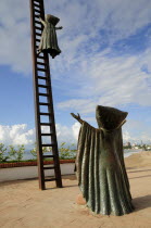 Mexico, Jalisco, Puerto Vallarta, Sergio Bustamente sculpture In Search of Reason, 1990, on the Malecon.