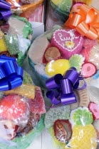 Mexico, Puebla, Colourful sweets wrapped and tied with brightly coloured ribbon.