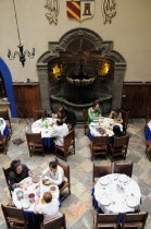 Mexico, Puebla, Elevated view over customers dining in courtyard of the Hotel Colonial.