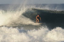 Mexico, Oaxaca, Puerto Escondido, Surfer in action.