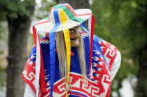 Mexico, Michoacan, Patzcuaro, Dancer in mask and costume performing Danza de los Viejitos or Dance of the Little Old Men in Plaza Vasco de Quiroga.