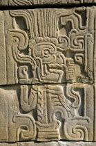 Mexico, Veracruz, Papantla, Relief carving of Mesoamerican god Quetzalcoatl the fethered serpent on wall of Juegos de Pelota Sur at El Tajin archaeological site.