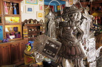 Mexico, Oaxaca, Shop interior with hojalata tin artwork displayed for sale.