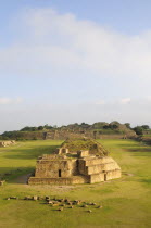 Mexico, Oaxaca, Monte Alban archaeological site, Ruins of Monticulo J and Edifio I, H and G buildings in the central plaza.