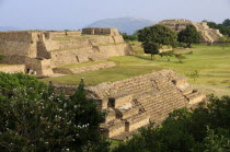 Mexico, Oaxaca, Monte Alban archaeological site, Ruins of Monticulo and Sistema IV buildings.