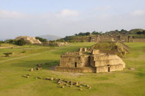Mexico, Oaxaca, Monte Alban archaeological site, Ruins of Monticulo J and Edifio I, H and G buildings in the central plaza.