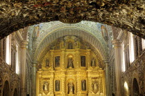 Mexico, Oaxaca, Church of Santo Domingo, Ornately decorated interior with carved and gilded altarpiece.