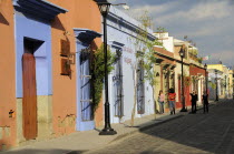 Mexico, Oaxaca, Street lined with colourful colonial buildings.