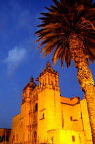 Mexico, Oaxaca, Santo Domingo Church, Baroque exterior at night.