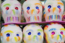 Mexico, Puebla, Sugar candies in the shape of skulls for Dia de los Muertos or Day of the Dead festivities.