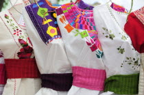 Mexico, Oaxaca, Hand embroidered blouses for sale.