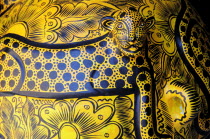 Mexico, Oaxaca, Detail of ceramic pot depicting spotted big cat in black and yellow.