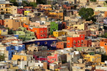 Mexico, Bajio, Guanajuato, Elevated view over colourful housing with flat rooftops.