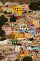 Mexico, Bajio, Guanajuato, Elevated view across brightly painted housing with flat rooftops.