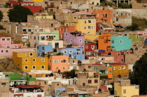 Mexico, Bajio, Guanajuato, View over brightly coloured houses spread out over hillside.