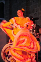 Mexico, Jalisco, Guadalajara, Plaza Tapatia, Folk dancer from Jalisco State dancing at carnival.