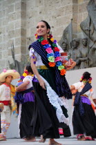 Mexico, Jalisco, Guadalajara, Plaza Tapatia, Woman folk dancer from Guerrero State performing in Carnival.