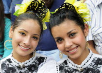 Mexico, Jalisco, Guadalajara, Portrait of two young women Jalisco folkloric dancers.