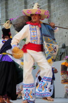 Mexico, Jalisco, Guadalajara, Plaza Tapatia, Male dancer from Guerrero State performing during carnival.