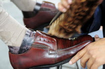 Mexico, Jalisco, Guadalajara, Plaza de la Liberacion, Cropped view of shoe shine at work.