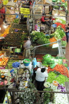 Mexico, Jalisco, Guadalajara, Mercado Libertad, View down on vegetable market stall displays and vendors.