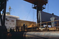 West Indies, Jamaica, Port Kaiser loading bauxite onto ship.