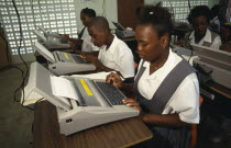 St Lucia, Students in typing class using electric typewriters at desks.
