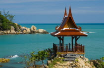Thailand, Koh Samui, Choeng Mon Bay, samui peninsula resort, massage spa house with ornate roof overlooking the beach.