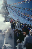 Nepal, Kathmandu, Boudhanath, burning pine bough incense during New Year or Los Har.