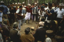 Nepal, Festivals, Male musicians and dancers at Dasain Mela festival in the woods.