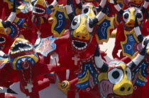 Venezuela, San Francisco de Yare, brightly coloured masks of devil dancers.