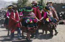 Peru, Cusco, Vilcanota Mountains, Tinqui, villagers in traditional costume dancing during wedding celebrations