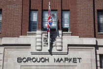 England, London, Southwark, Borough Market entrance with union flag flying.