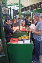 England, London, Southwark, Borough Market, Londons oldest fresh fruit and vegetable market, stall selling salt beef sandwiches.