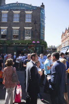 England, London, Southwark, Borough Market, Londons oldest fresh fruit and vegetable market, people outside the Market Porter pub enjoying a lunchtime drink.