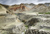 Nepal, Colorful layered mountains and eroded plateau along the route from Ghemi to Lo Manthang.