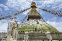 Nepal, Kathmandu, Boudhanath Stupa, Five-color prayer flags and symbolic sculptures with mantras.