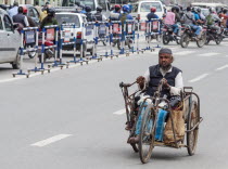 Nepal, Kathmandu, Old man using hand pedal powered tricycle.