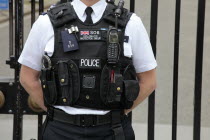 England, London, Detail of Police stab proof vest with various accessories.